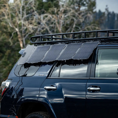 The Spectre solar panel mounted along the roof rack of a vehicle.